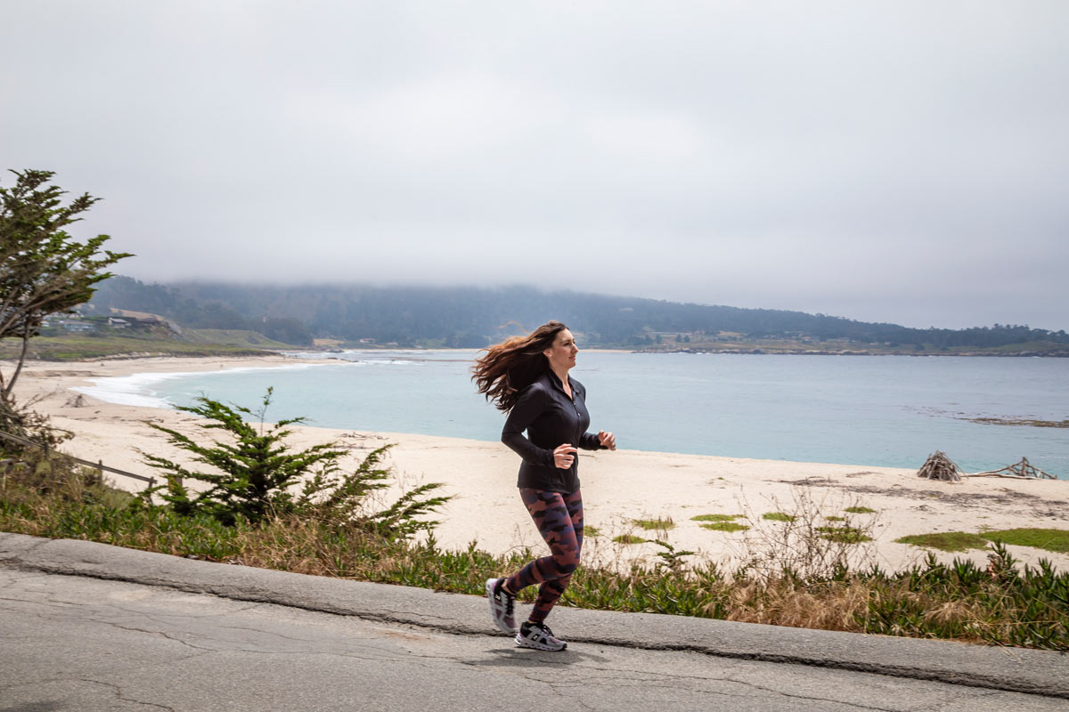 MCR REALTOR(R) Jenn Menke running along Scenic Road in Carmel-by-the-Sea, CA