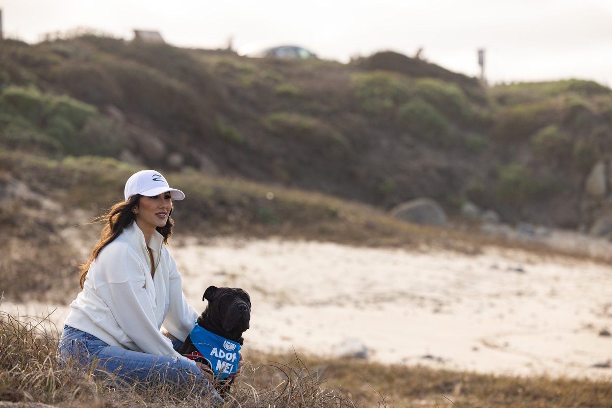 Kim Bartholomay at the beach volunteering for dog rescue