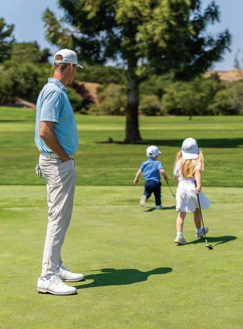 Matt Pridey and family on the putting green